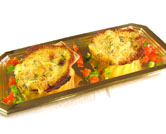 Vieiras gratinadas con espinacas y langostinos